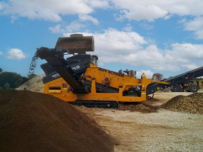 Anaconda DF410 scalping screen fed by a loader bucket