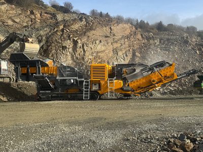 Anaconda I14 impact crusher fed by an excavator in a quarry